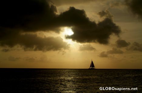 Postcard Aruba - sunset and a boat