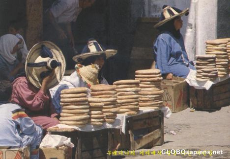 Postcard Ladies saling bread