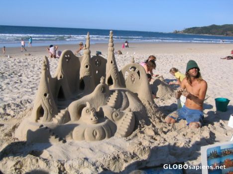 Postcard Sand castle man on the beach