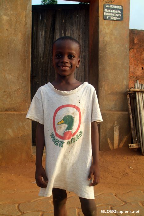 Postcard Ouidah - a young local in funny t-shirt