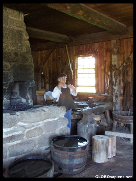 Postcard Forging a nail at Leger's blacksmith shop