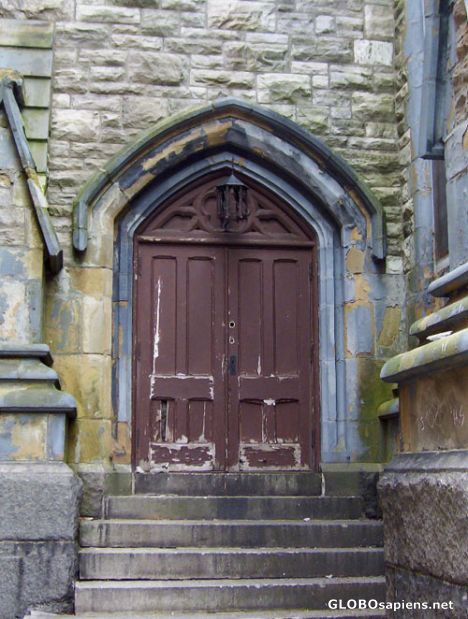 Postcard Door on old church that is now used as a gym.