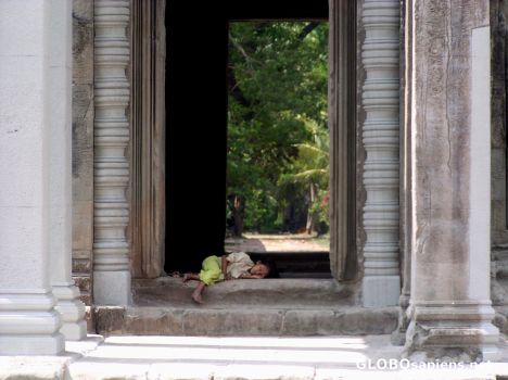 Postcard Local boy sleeping in Angkor Wat