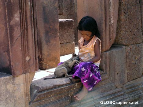 Postcard Girl with puppy at Banteay Srei