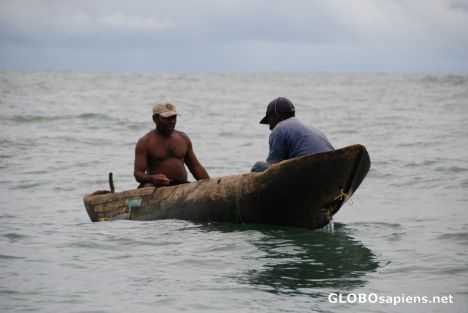 Postcard Fishermen in repaired dug-out canoe