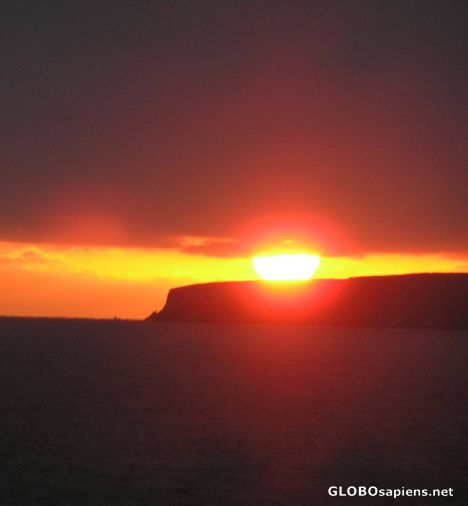 Postcard Sun sinks into the Atlantic
