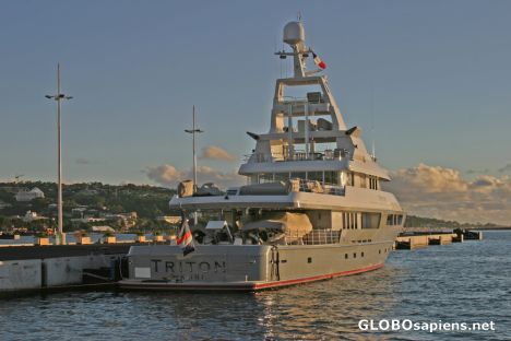 Postcard Papeete Harbor: A luxury American yacht is calling