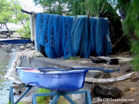 Postcard Pointe Venus - blue boat and fishing net