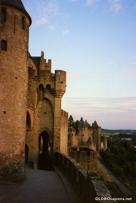Postcard Carcassonne City wall with Towers in the evening