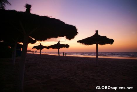 Postcard Kotu (GM) - Parasols on the beach at sunset