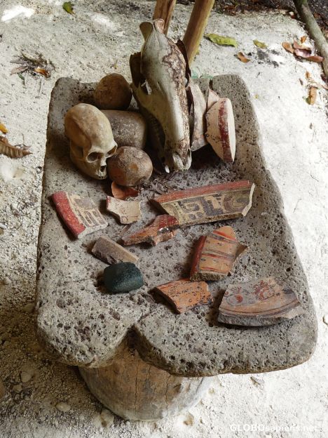 Postcard Broken 2,300 year old pottery on a metate