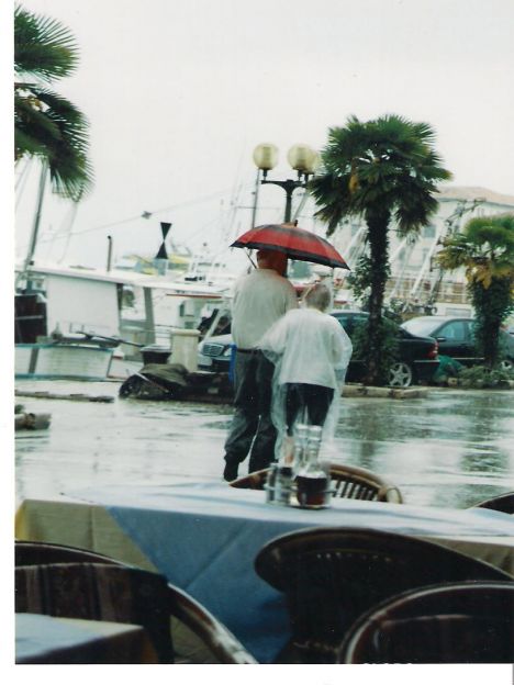 Postcard Walking in the rain, the harbour, Porec.