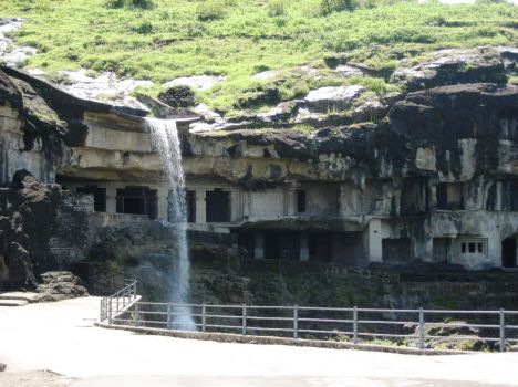 Postcard Waterfall falls over 3 story Dormitory Caves