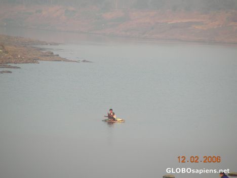 boy fishing in early morning hours in river Ulhas