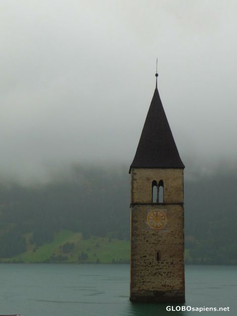 Postcard Old bell tower in the morning rain -
