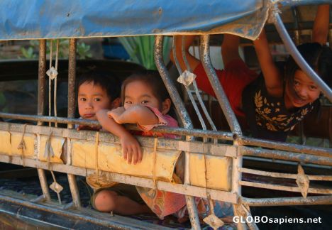 Postcard Luangprabang - Lao children on a bus