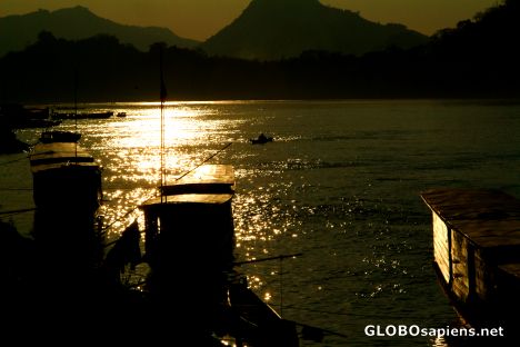 Postcard Luangprabang - long boats on the Mekong