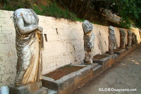 Postcard Cyrene - a statue studded alley