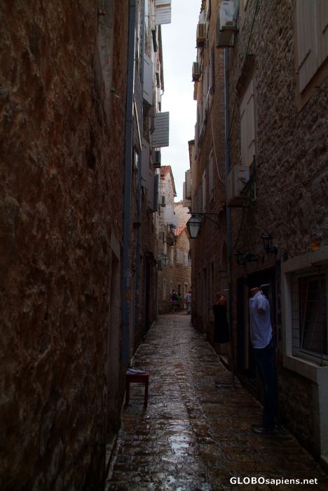Postcard Budva (ME) - old town narrow alley in rain