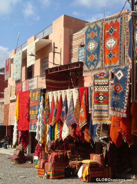 Postcard Colourful carpets in the souks.