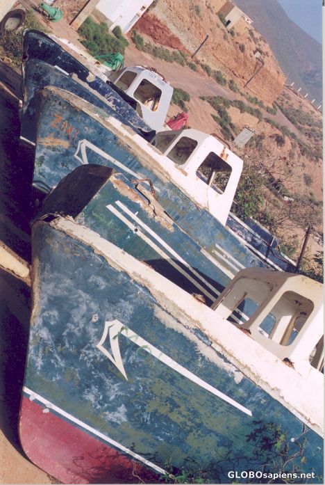 Postcard Fishing boats beached in the desert.
