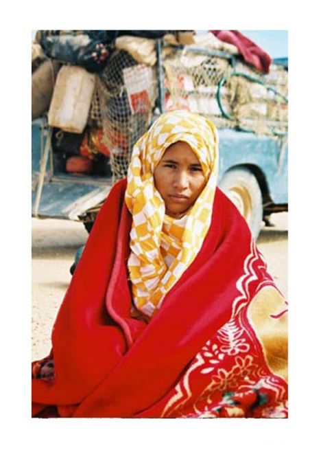 Postcard Woman in blanked in the Sahara Desert