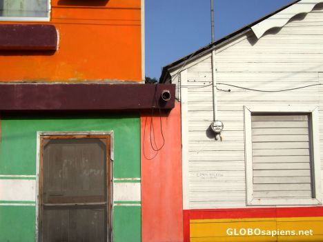 Postcard colourful house in Isla (orange, white green)