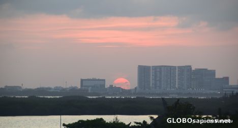 Postcard Sun setting over Cancun