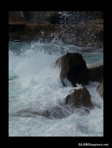Postcard Wave splashing on rocks
