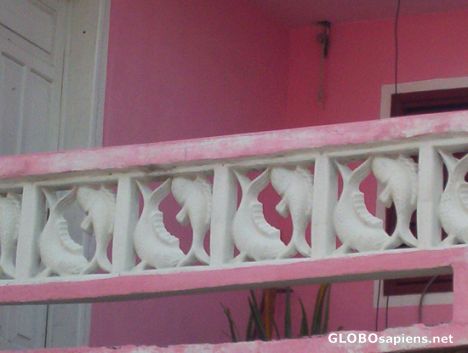Postcard Pink house with fish design railing, Punta Norte