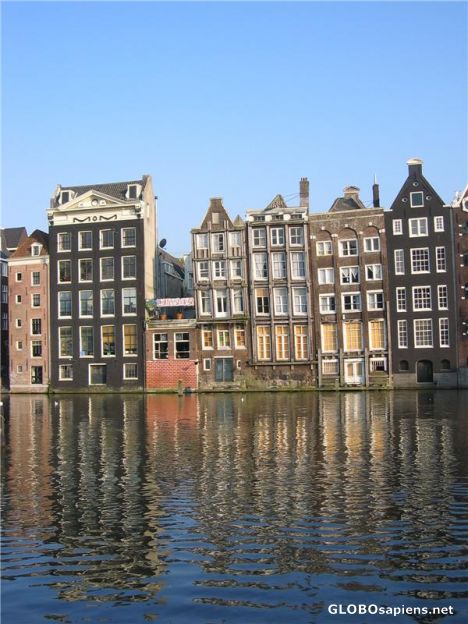 Postcard Canal and colourful buildings in Amsterdam