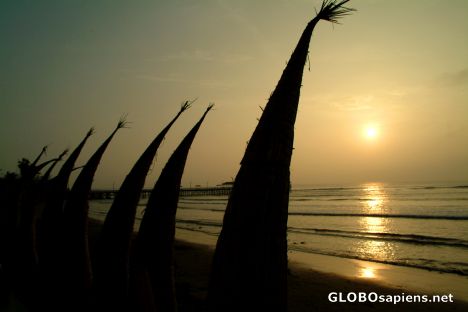 Postcard Huanchaco - sunset and the reed boats