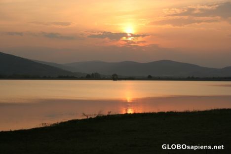 Postcard Sunset over an artificial lake