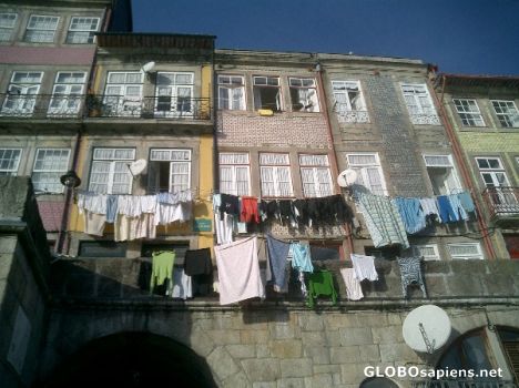 Postcard Hanging wet clothes in the street