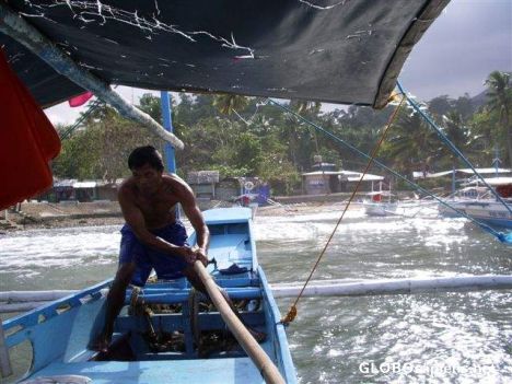 Postcard Bangka boatman fighting the waves