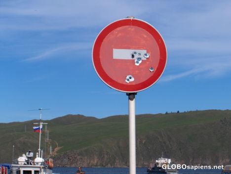 Postcard Some shoot marks on a sign at the Baikal Lake