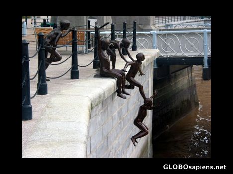 Postcard Kids jumping into  Singapore River.