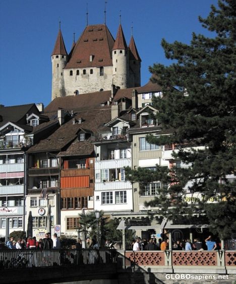 Postcard River Cafe with old Town and Castle of Thun