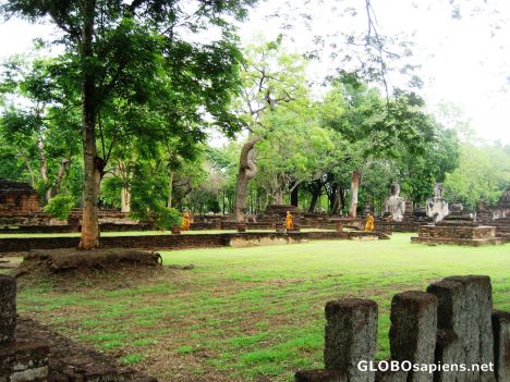 Postcard Monks walk in Kamphaeng Phet Historical Park