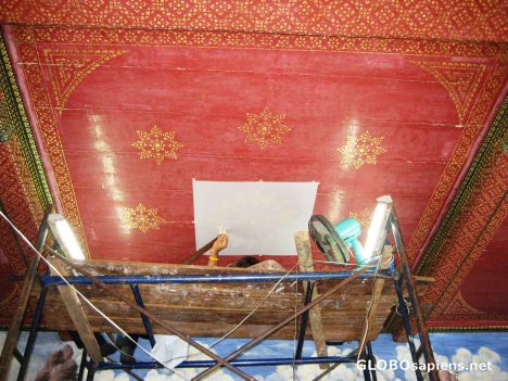 Postcard Artist works on back to restore Grand Palace