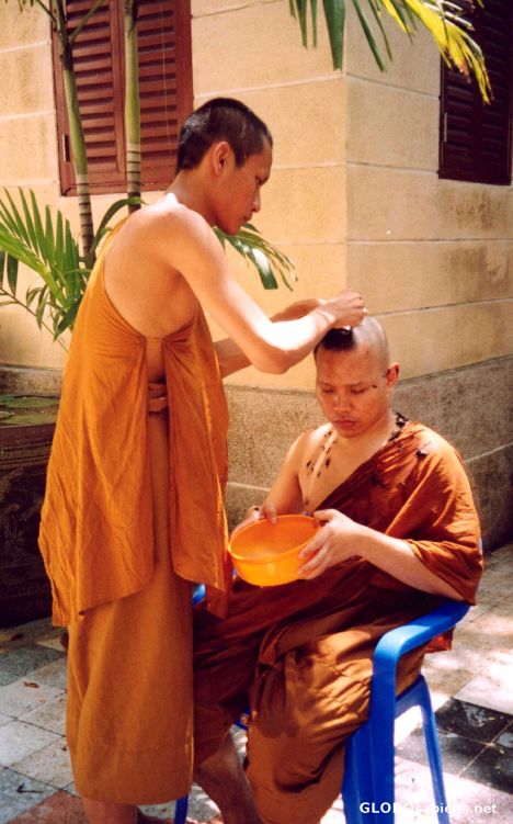 Postcard Monk getting head shaved, Bangkok