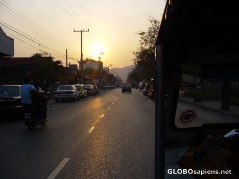 Postcard Sun is going under,picture taken out of a tuk-tuk