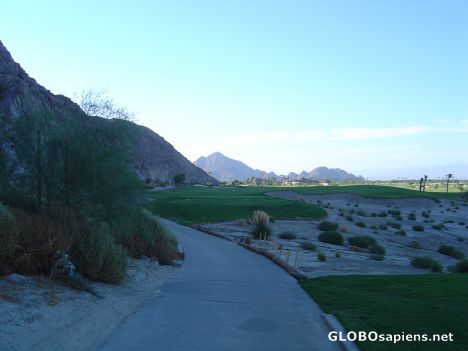Postcard Desert, Mountains, and artificial greens of golf
