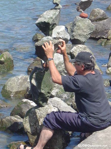 Postcard guy balancing rocks
