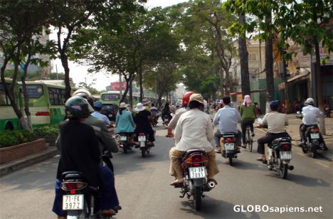 Postcard Cycling amonst Ho Chi Minh City Traffic