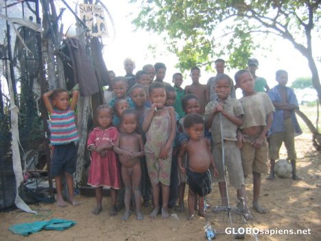 Postcard Bushmen children at settlement village.