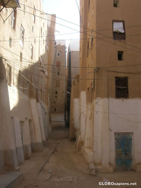 Postcard One of the narrow streets in Shibam