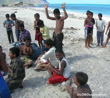 Postcard Children dancing in the beach