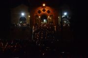 Midnight at Easter, crowds with candles at one of the churches in Paphos.