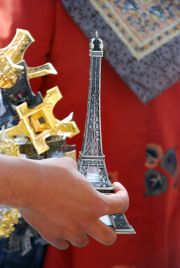 small Eiffel in hands of a seller